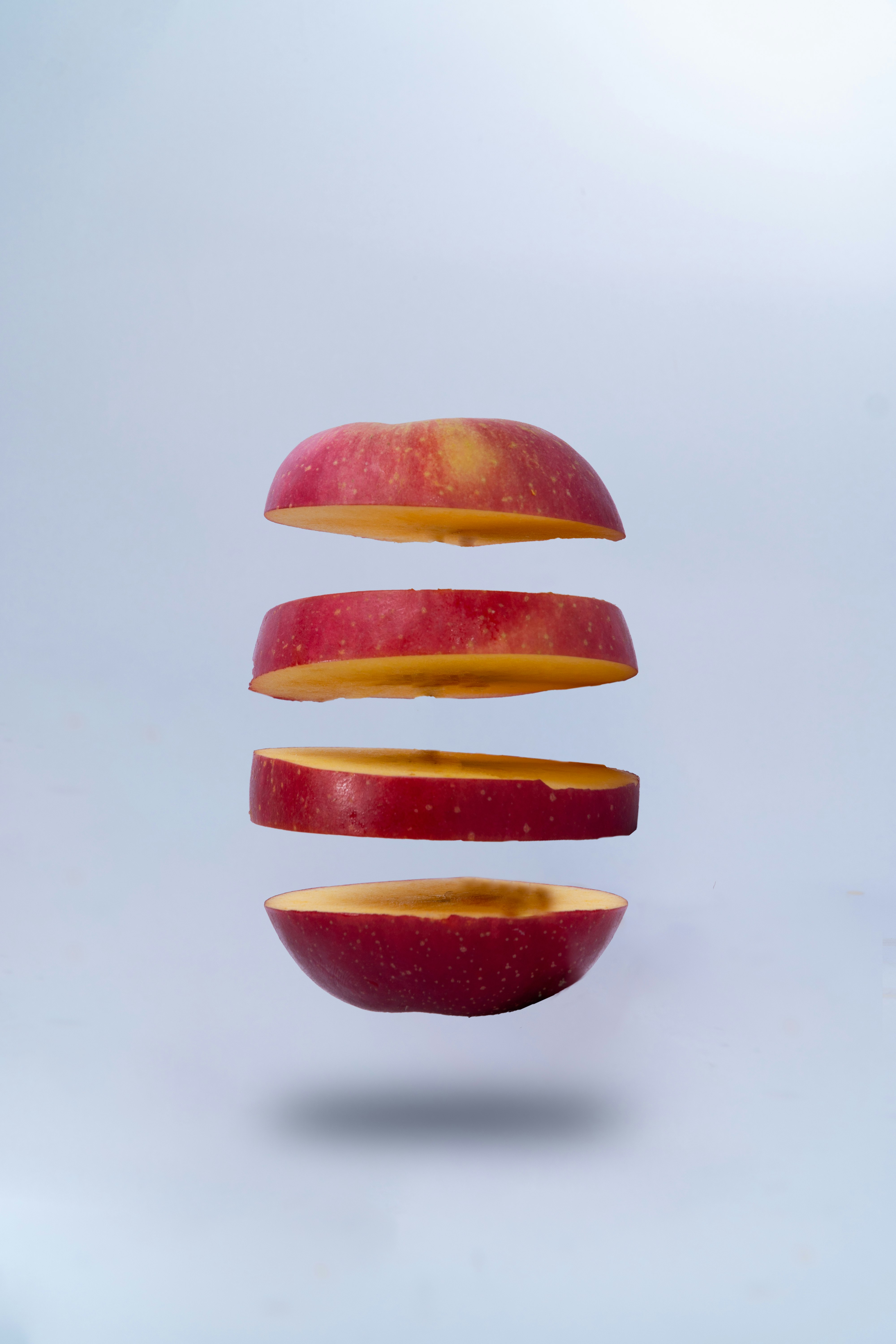 sliced orange fruit on white surface